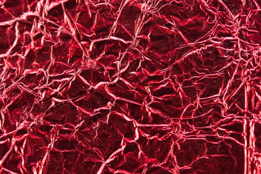 close up of red aluminum foil texture background