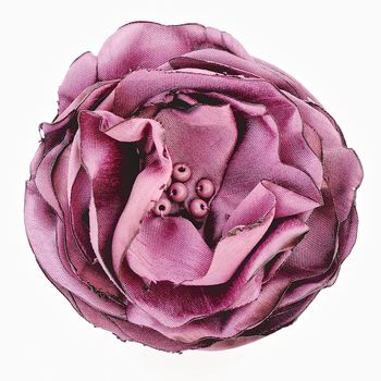 Artificial pink flower of silk isolated on white background