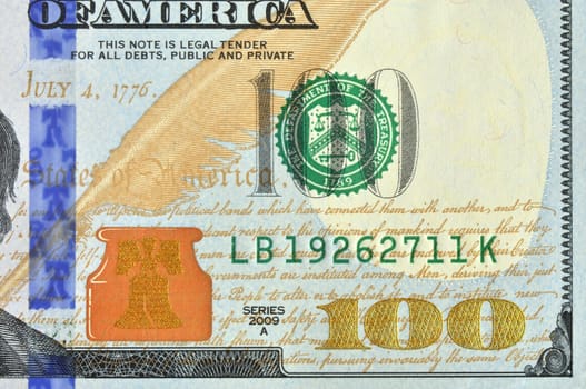 Hundred american dollars macro image. New look redesigned banknote. Front right down corner.