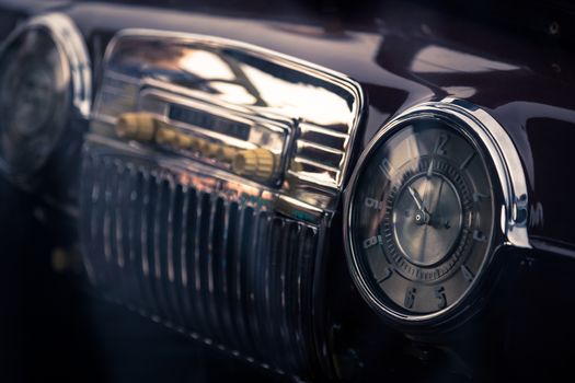 Clock in retro interior of old automobile