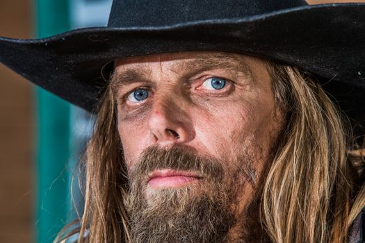 Close-up of a gruff looking old west bandit