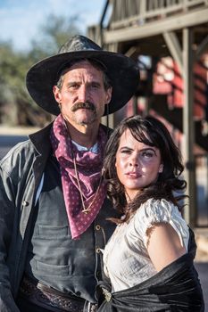 Portrait of an old west woman and sheriff