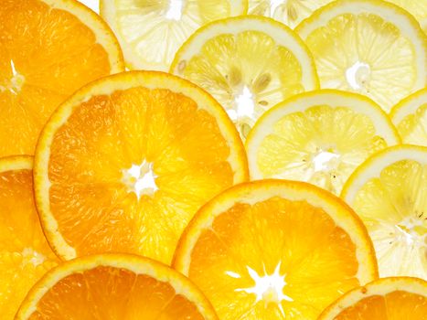 sliced ripe and juicy lemon and oranges background
