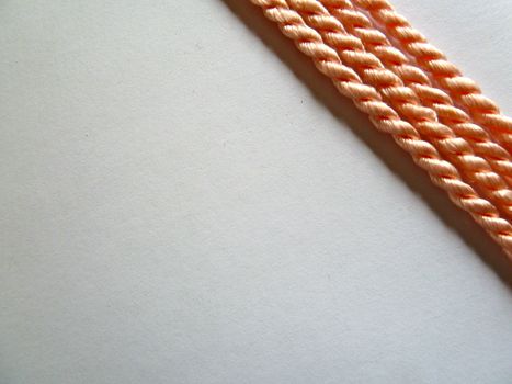 Bright orange ropes in a diagonal design