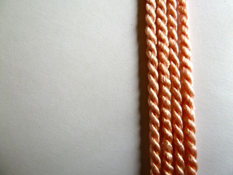 Bright orange rope lines on a white background