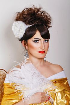 Attractive young woman with high hair and great makeup shot closeup