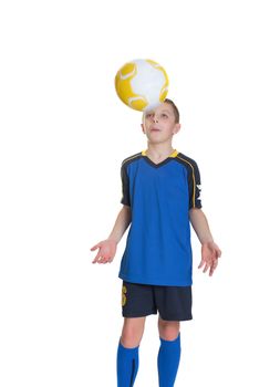 Ten year old boy with a soccer ball isolated on white background.