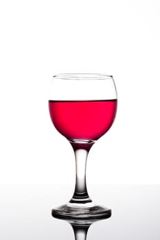 Classy colrfull backlit red vine glass with reflection
