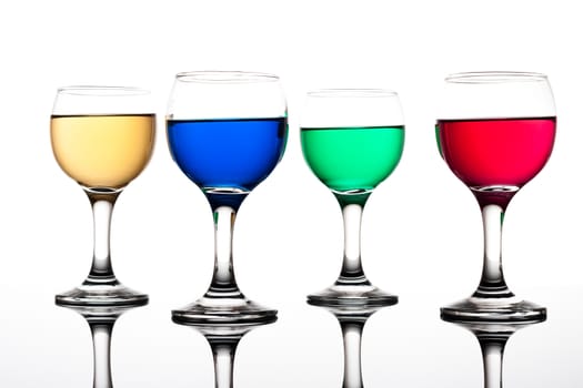 red, green, yellow and blue backlit drinks with reflection