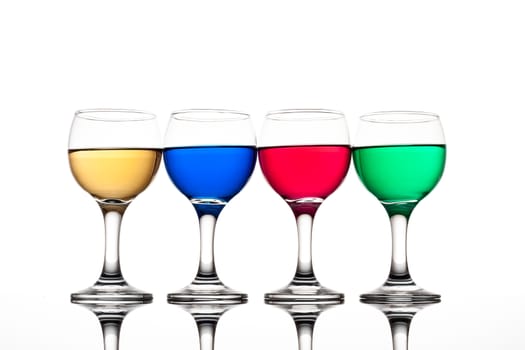 red, green, yellow and blue backlit drinks with reflection