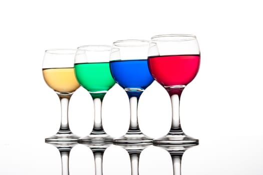 red, green, yellow and blue backlit drinks with reflection