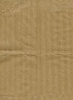 Brown corrugated cardboard sheet useful as a background