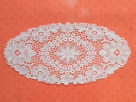 white mat crotch doilie isolated over red background