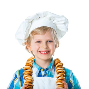 Little Cook Boy With A Bagels. Isolated on white background.