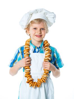 Little Cook Boy With A Bagels. Isolated on white background.