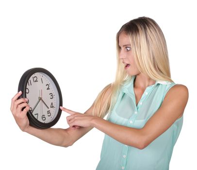 Young woman poiting to the time on a clock concept