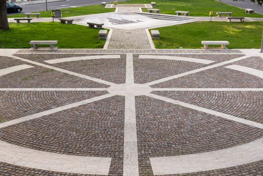 paved square and circular shapes and geometric designs