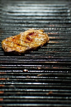 closeup of a steak on a grill