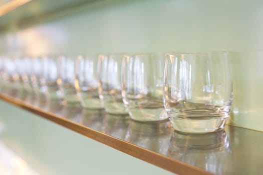 water glass on wooden rack