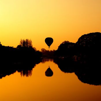 Hot Air Balloon at Sunrise on the river