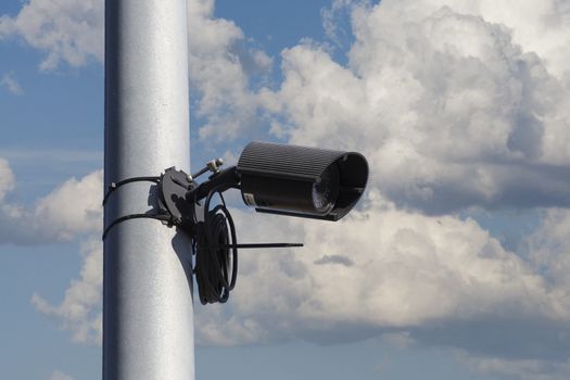 Security camera, city safe, cloudy sky