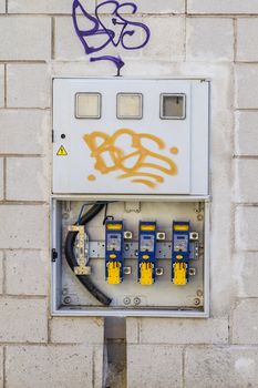 Electricity box over bricks wall