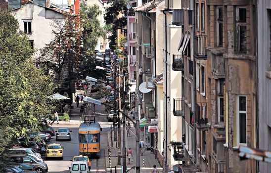 SOFIA, BULGARIA - JUNE 25: General street view of "Bacho Kiro" str, some 300m. from Council of ministers building with a tram in Sofia, Bulgaria - June 25, 2013 .