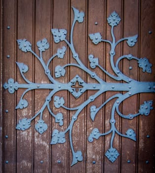 Rustic Ornametal Hinge On A Wooden Church Door