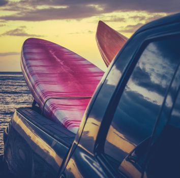 Retro Filtered Style Surfboards In A Truck At Sunset In Hawaii