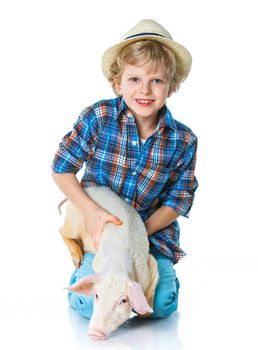 Little farmer. Cute boy with pig. Isolated on white background.