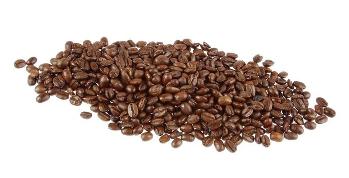 Closeup of coffee beans on plain background