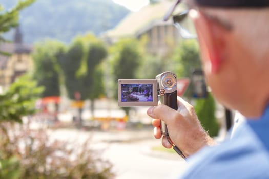 elderly man with video camera