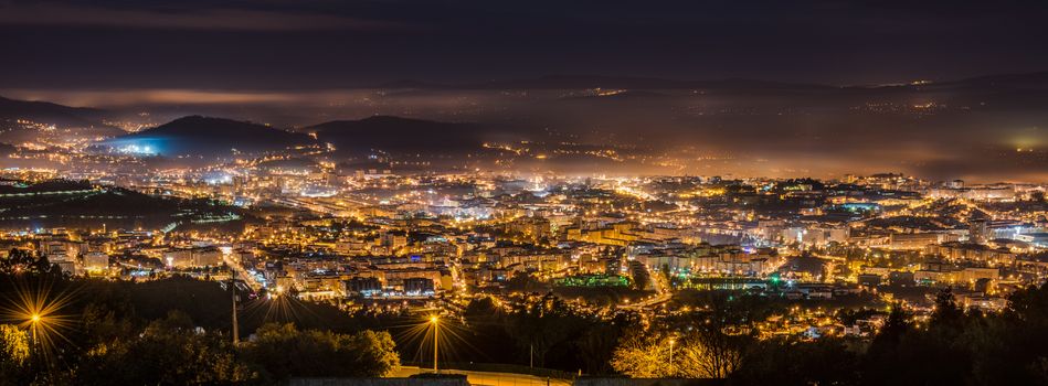 Panorama of lighted city of Braga at night, Portugal