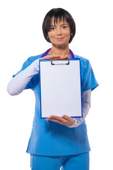 asian beautiful female doctor wearing blue uniform holding and showing clipboard with blanc sheet isolated