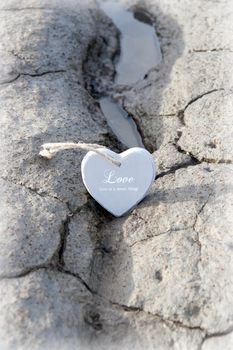 two wooden love hearts on the sand banks of an Irish beach in county Kerry
