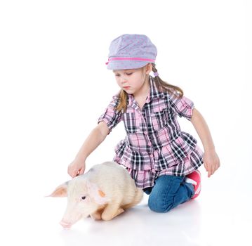 Little farmer. Cute girl with pig. Isolated on white background.