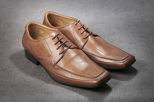 Pair of brown men's shoes.