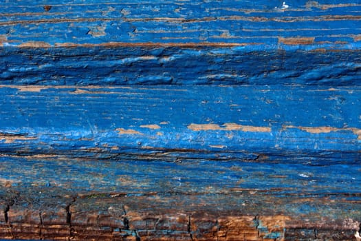 Worn wooden benches time board covered with blue paint