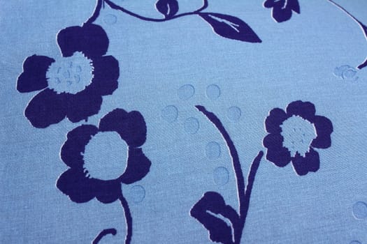 on blue cloth painted three flowers dark blue