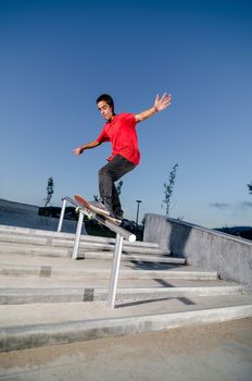 Skateboarder on a slide at the local skatepark.