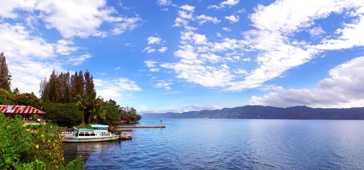 Boat and Lake Toba Panorama. Samosir Island North Sumatra, Indonesia.