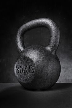 A rough and tough heavy 30 kg 66 lbs cast iron kettlebell.