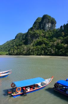 Tourist boats at Island of the Pregnant Maiden lake, Marble Geoforest Park, Langkawi, Malaysia