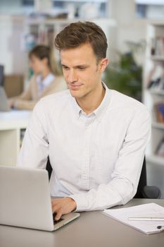 Man Cheerful desk laptop young colleagues