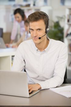 Male calling computer desk video conference