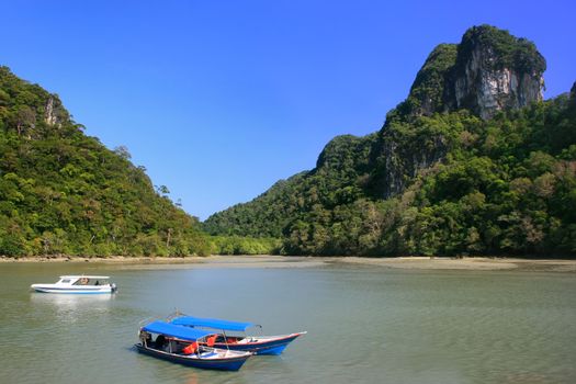 Tourist boats at Island of the Pregnant Maiden lake, Marble Geoforest Park, Langkawi, Malaysia