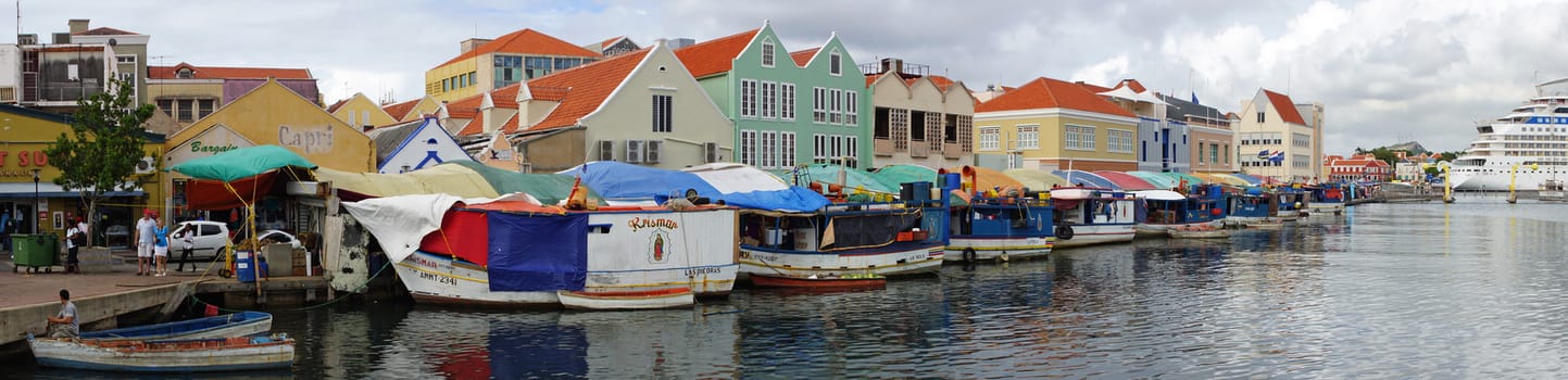 WILLEMSTAD, CURACAO - DECEMBER 10, 2013: Floating Market on the harbor of Willemstad on December 10, 2013 in Curacao, ABC Islands