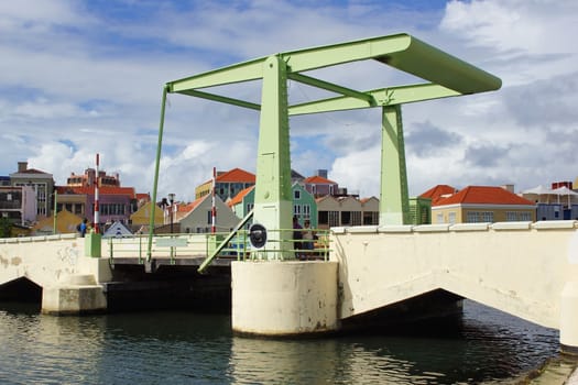 WILLEMSTAD, CURACAO - DECEMBER 10, 2013: Queen Wilhelmina Bridge on December 10, 2013 in Willemstad, Curacao, ABC Islands.