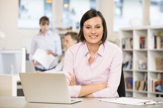 cute female desk laptop colleagues smiling