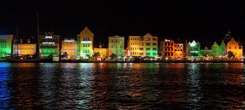 WILLEMSTAD, CURACAO - DECEMBER 10, 2013: Panorama of Punda district at night on December 10, 2013 in Willemstad, Curacao, ABC Islands,